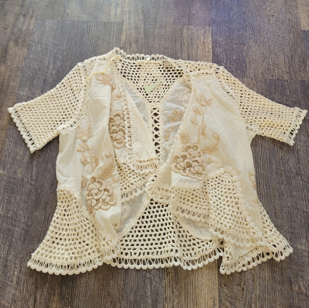 Knitted and knotted crochet embroidered cardigan ⁶³